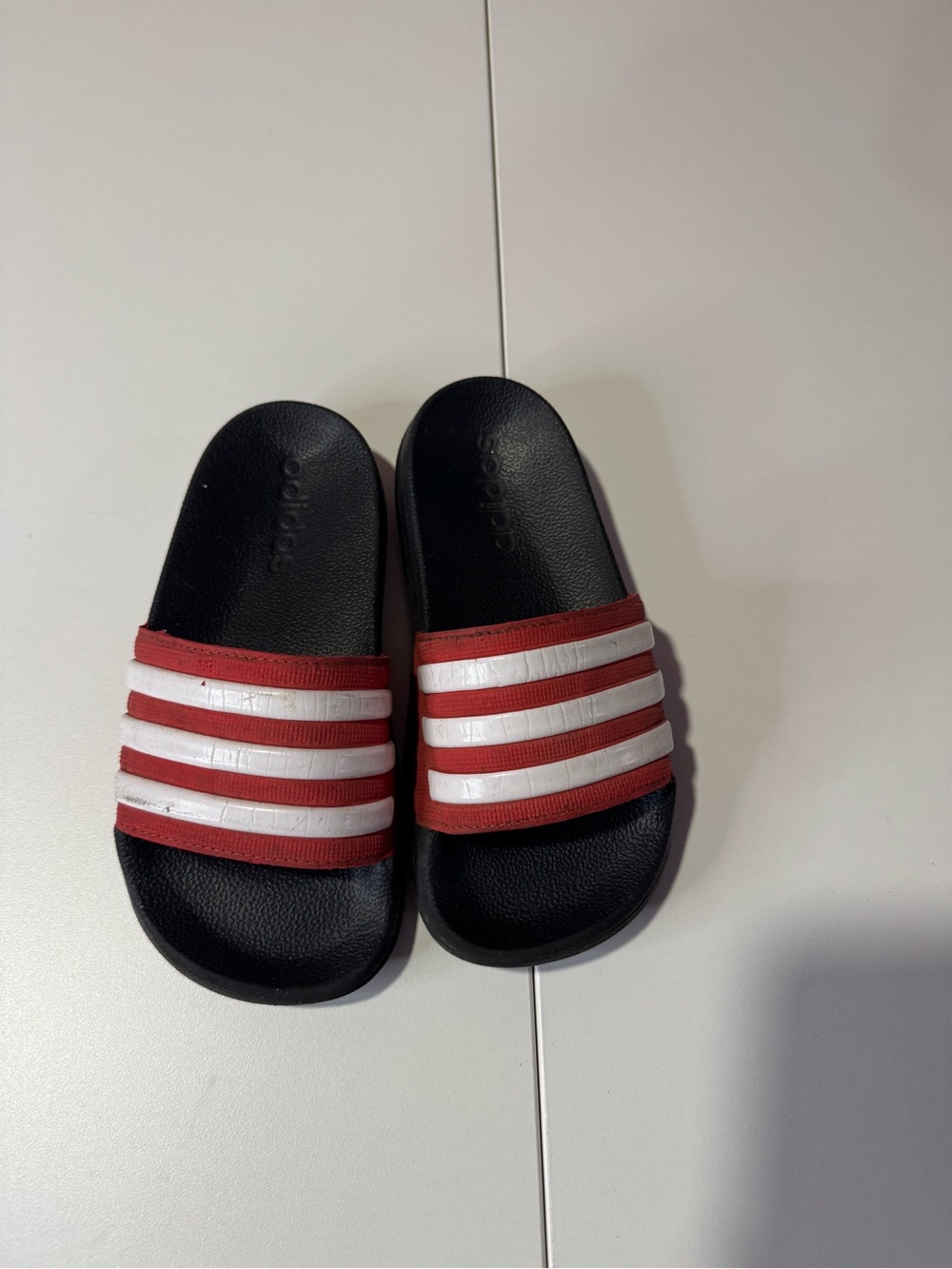 adidas Kids Black and Red Slide Sandals with White Stripes
